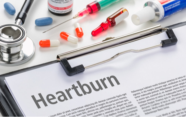 The diagnosis Heartburn written on a clipboard